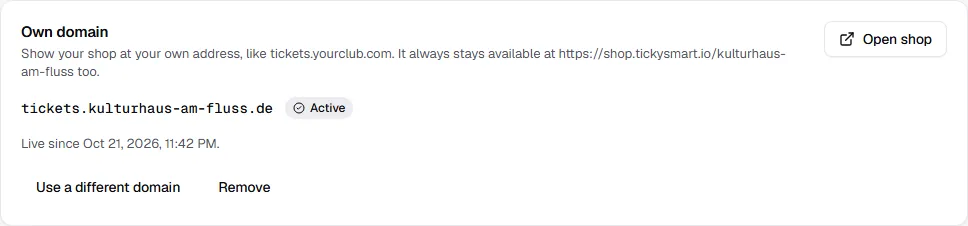Active domain tickets.kulturhaus-am-fluss.de with the date it went live and the buttons Open shop, Different domain and Remove